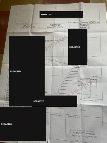 Redacted surveyor site plan for a larger client parcel. Client name and surveyor details are blacked out.